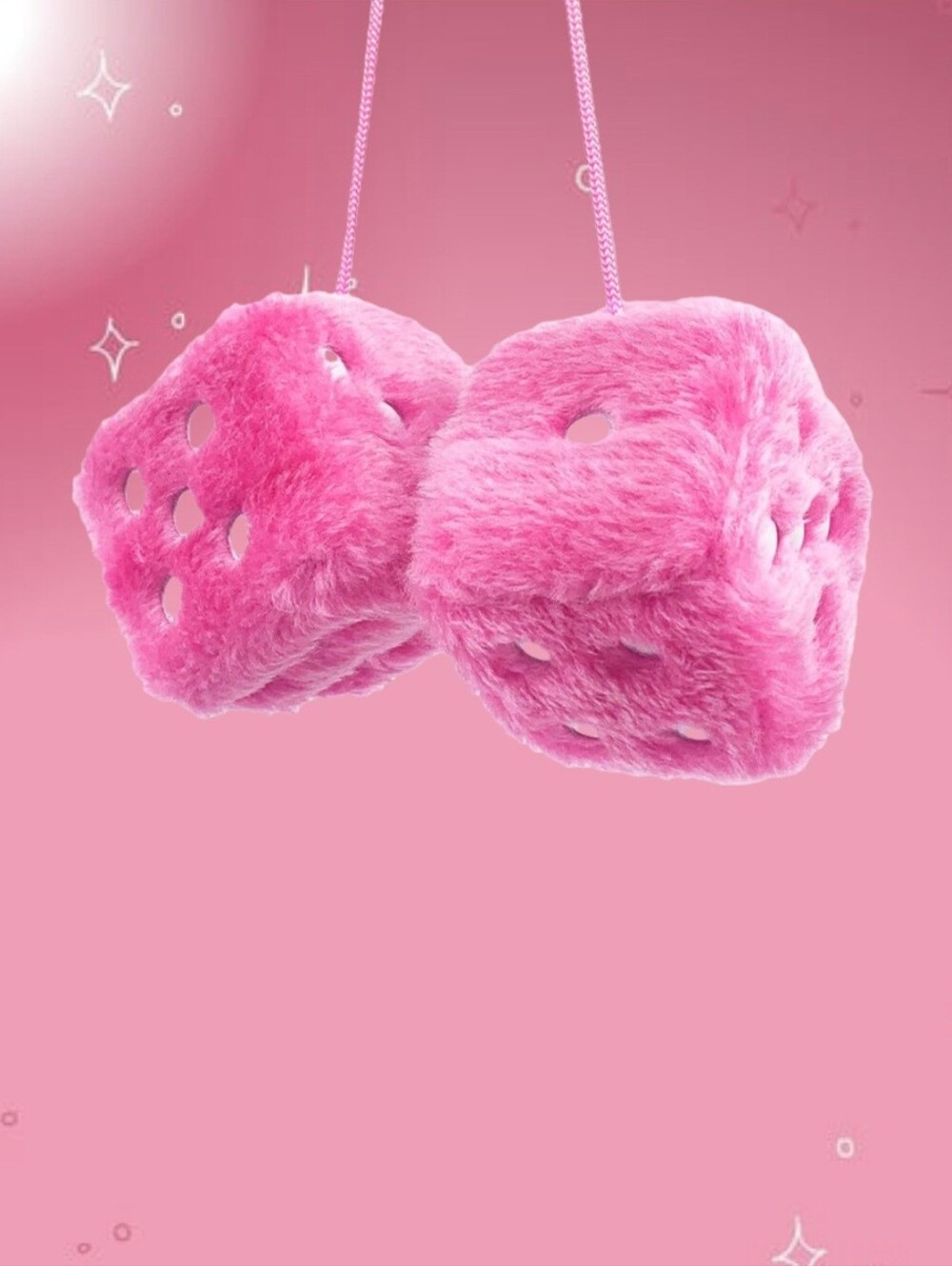 Pink fuzzy dice with white polka dots
